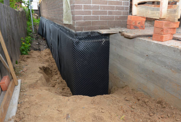 Happy homeowners after waterproofing job in Union Mills
